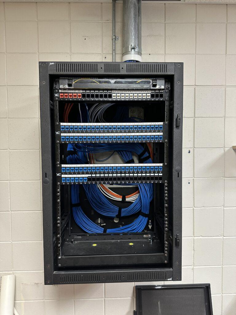 Data cabling/ network rack in a school, an eligible E-rate service.